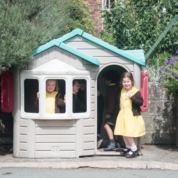 Children by playhouse