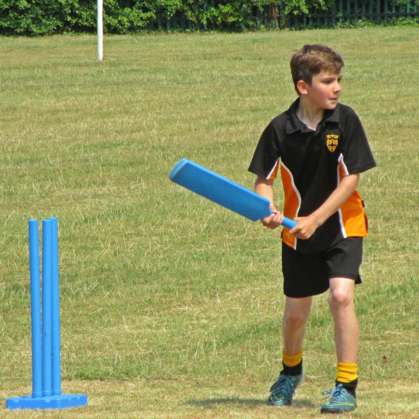 Boy playing cricket